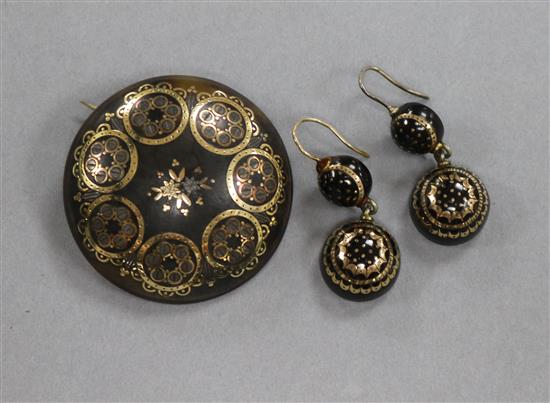 A pair of early 20th century tortoiseshell pique earrings and a similar brooch, brooch 41mm.